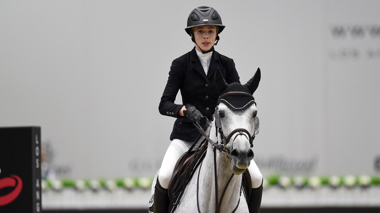 Hannah Selleck competing on horseback in 2015