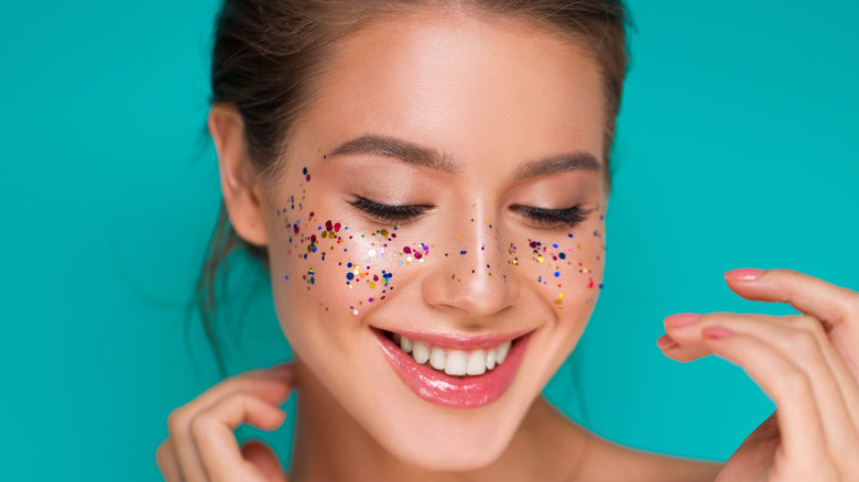 Woman wearing glitter lip gloss