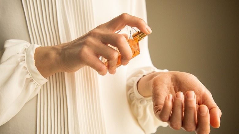 A woman testing perfume