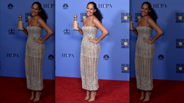 Tracee Ellis Ross holding award