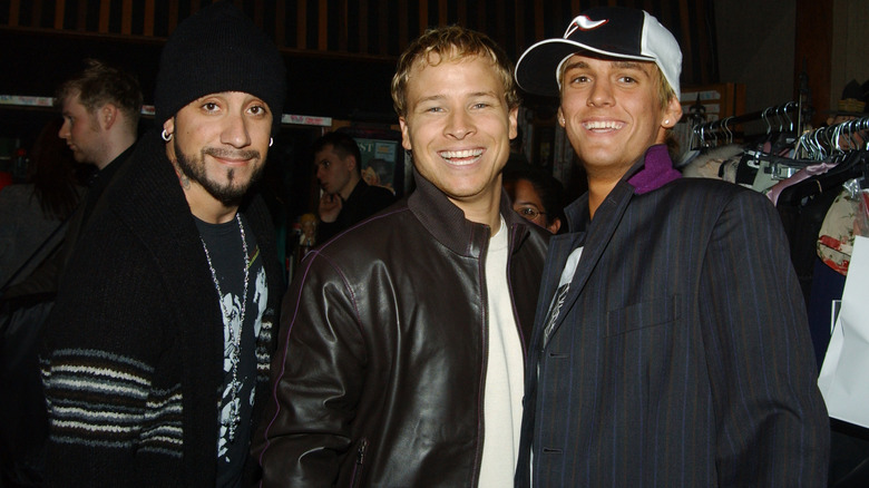 AJ McLean, Brian Littrell, and Aaron Carter posing 