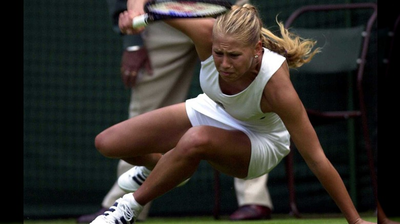 Anna Kournikova falling during tennis match