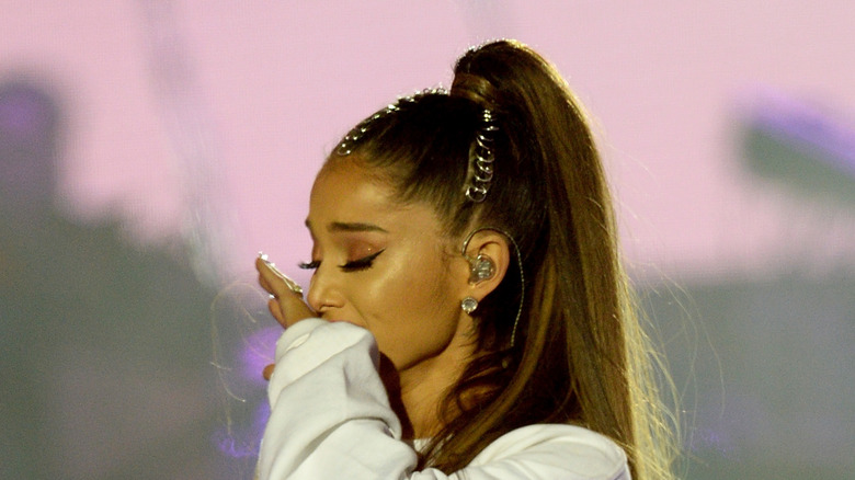 Ariana Grande wipes a tear during the "One Love Manchester" concert in 2017