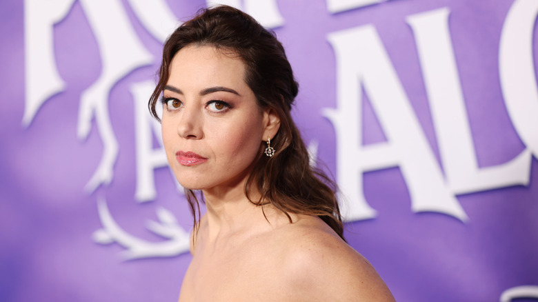 Aubrey Plaza stars into the camera lens