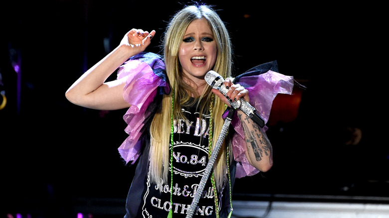 Avril Lavigne singing onstage