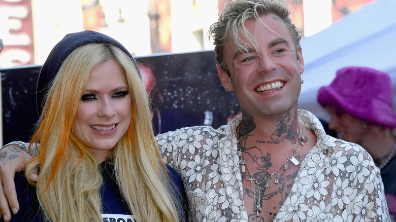 Avril Lavigne smiling with Mod Sun