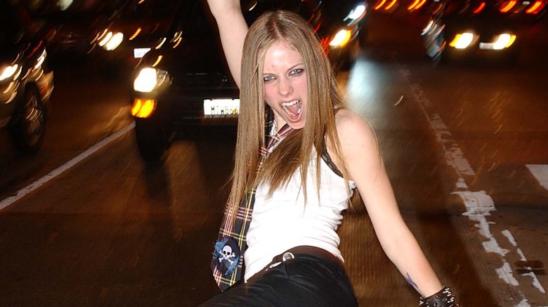 Avril Lavigne posing in traffic