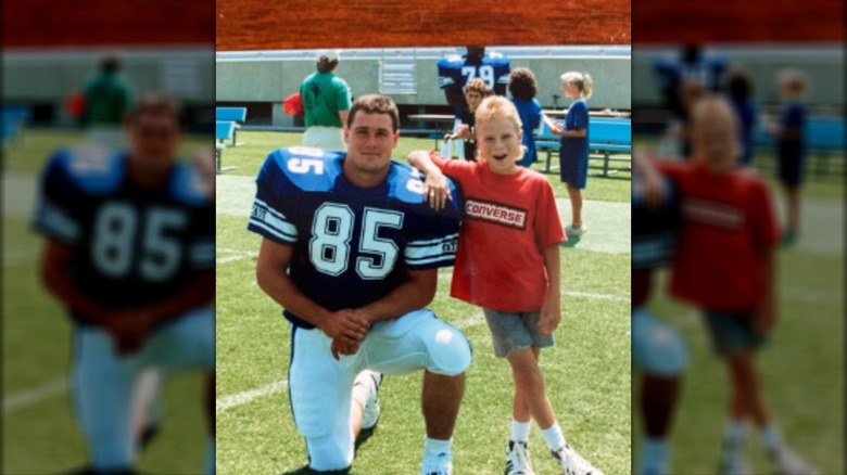 Brian Littrell standing next to a football player in 1986.