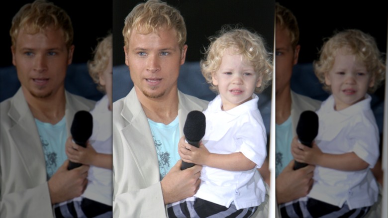 Brian Littrell holding his son Baylee on stage in New York, 2005.