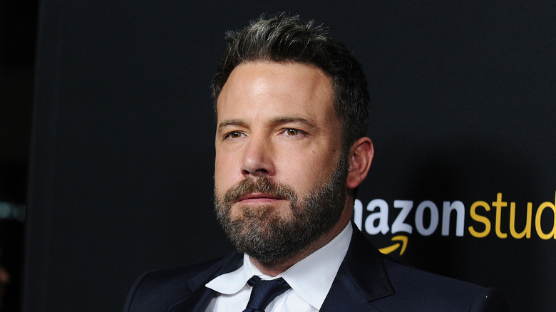 Ben Affleck in a tux with white-streaked hair and beard