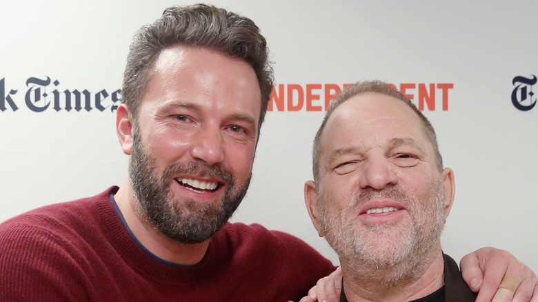 Ben Affleck holding Harvey Weinstein's shoulders