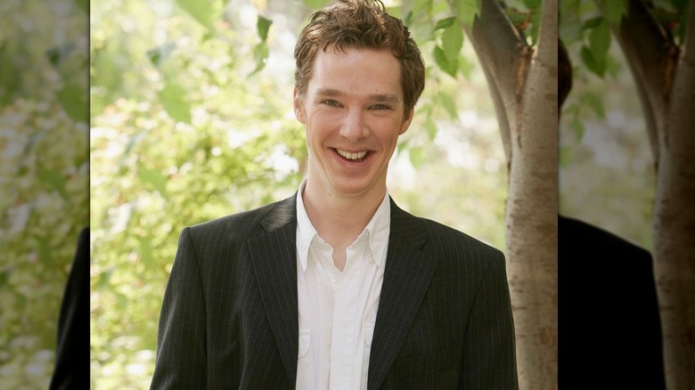 Young Benedict Cumberbatch posing with trees