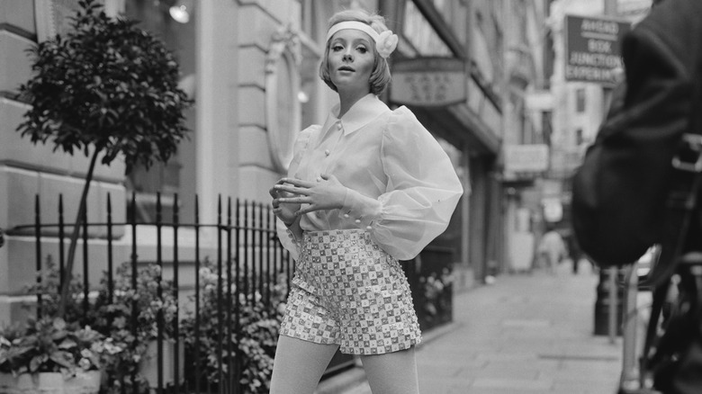 Genevieve Waite posing on a sidewalk