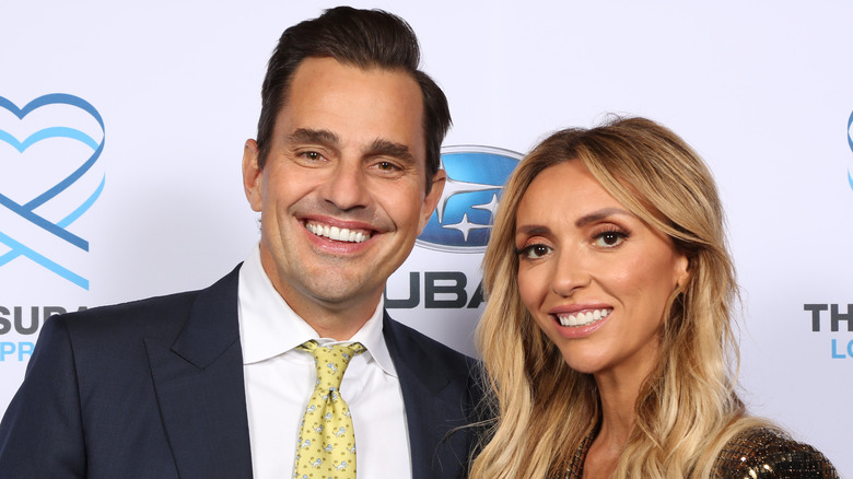 Bill Rancic and Giuliana Rancic posing at an event