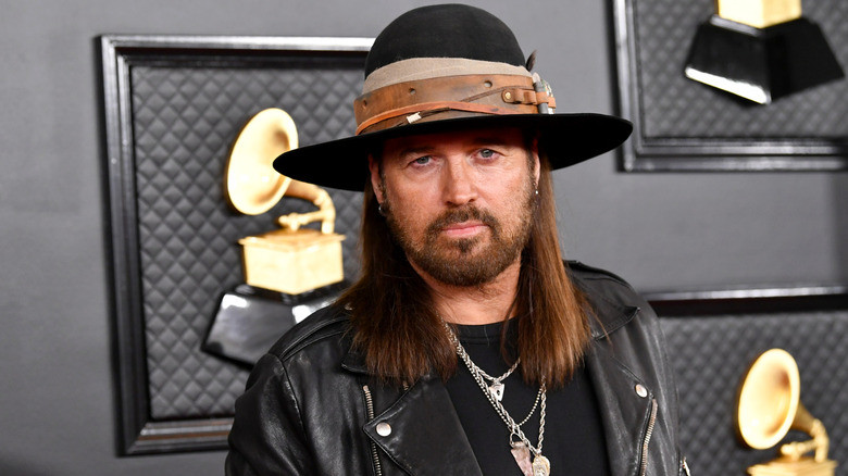 Billy Ray Cyrus posing for photos