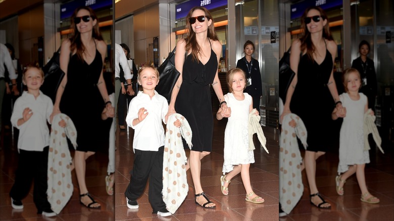 Angelina Jolie walking and holding hands with young Knox and Vivienne Jolie-Pitt