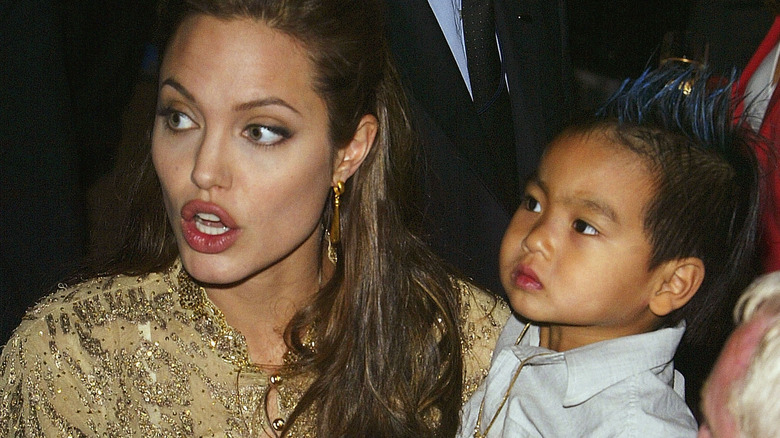 Angelina Jolie holding Maddox Jolie-Pitt