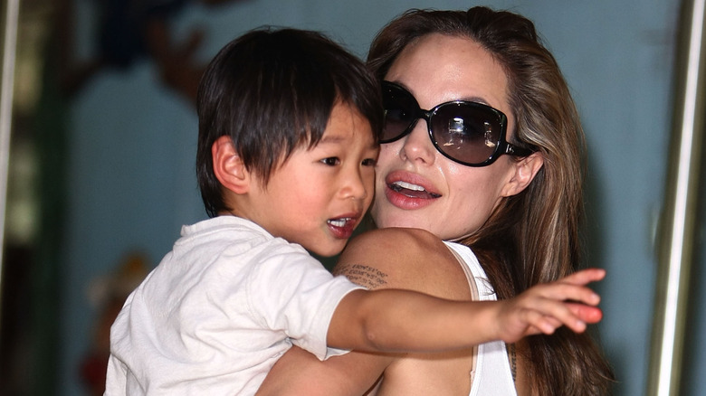 Angelina Jolie holds her son, Pax Jolie-Pitt