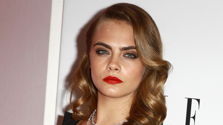 Cara Delevingne wearing red lipstick