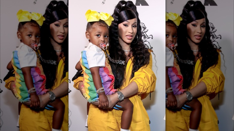 Cardi B holding her daughter 