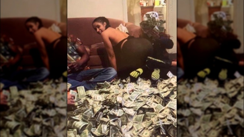 Cardi B with a pile of money 