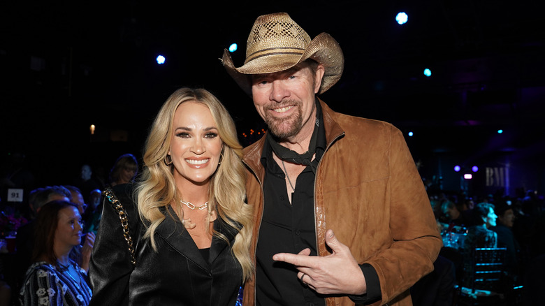 Carrie Underwood and Toby Keith smiling