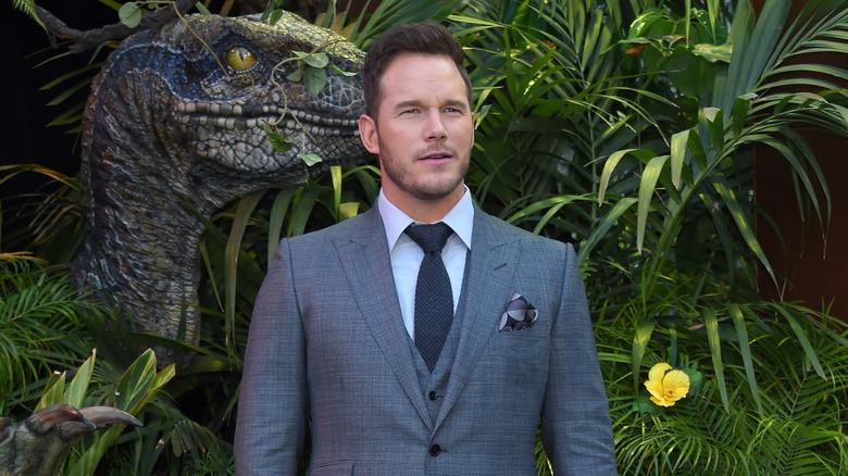 Chris Pratt posing for promotional photos for Jurassic World