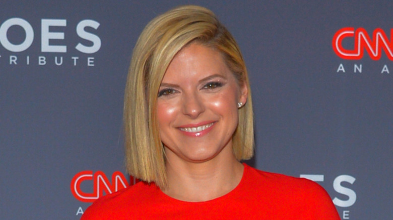 Kate Bolduan smiling at a CNN red caret event