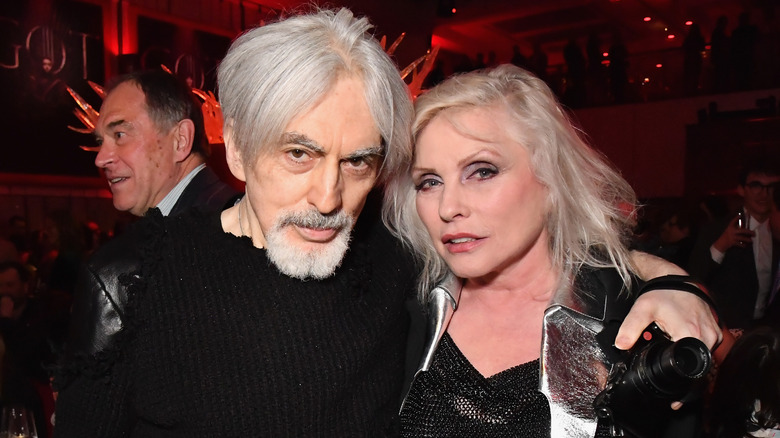 Debbie Harry with Chris Stein both wearing black