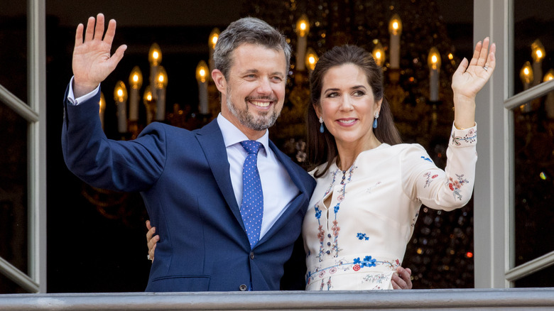 King Frederik and Queen Mary waving