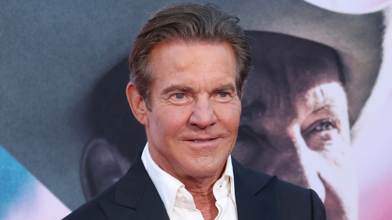 Dennis Quaid staring ahead smiling