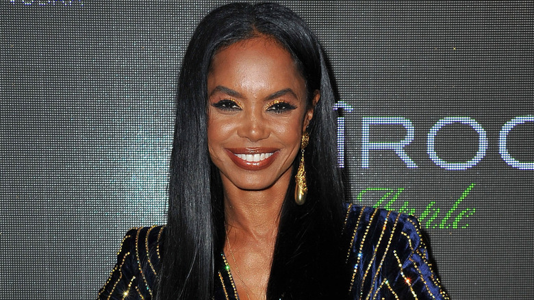 Kim Porter smiling