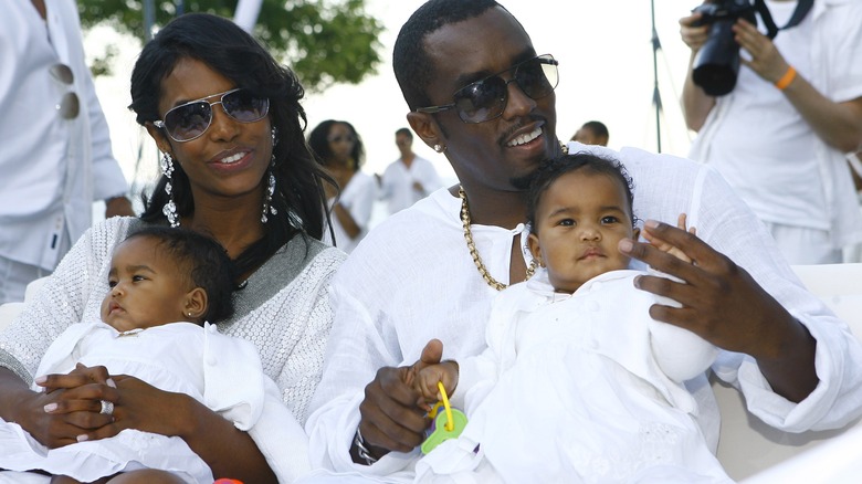 Kim Porter, Diddy, and their twins sitting together