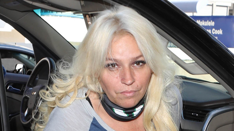 Beth Chapman exiting a vehicle