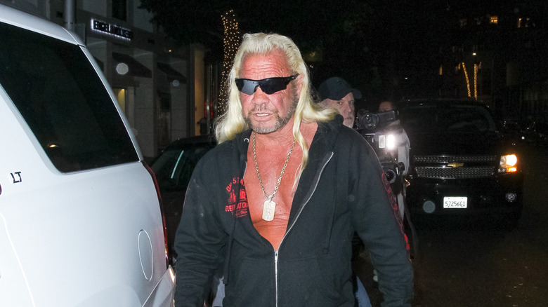 Dog the Bounty Hunter in a black hoodie and sunglasses on November 28, 2018