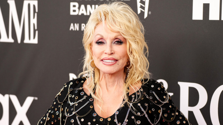 Dolly Parton posing for photos