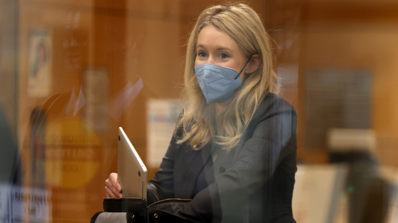 Elizabeth Holmes goes through security while entering court