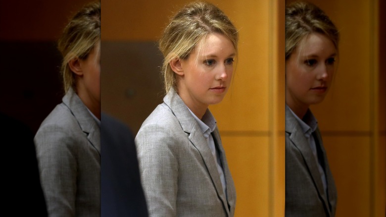 Elizabeth Holmes wearing gray in court in 2019