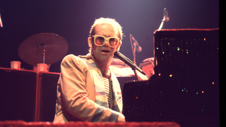 Elton John singing at piano