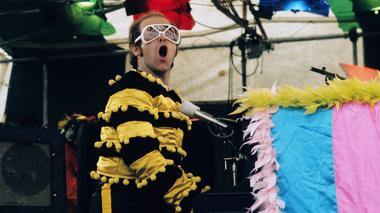 Elton John performing at piano