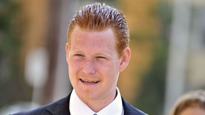 Redmond O'Neal wearing a suit