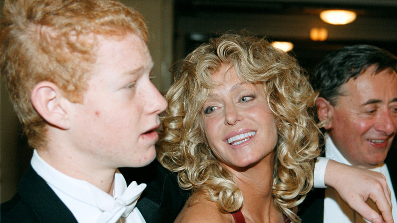 Farrah Fawcett smiling at Redmond O'Neal