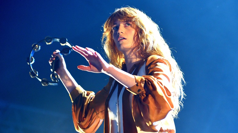 Florence Welch holding tambourine