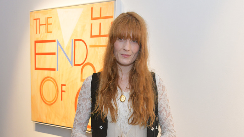 Florence Welch standing in gallery