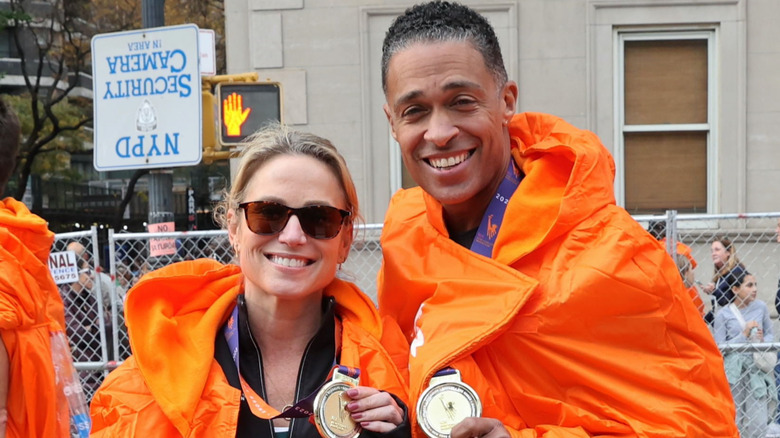 Amy Robach and T. J. Holmes after running the 2023 New York City Marathon