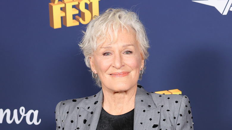 Glenn Close smiling on a red carpet