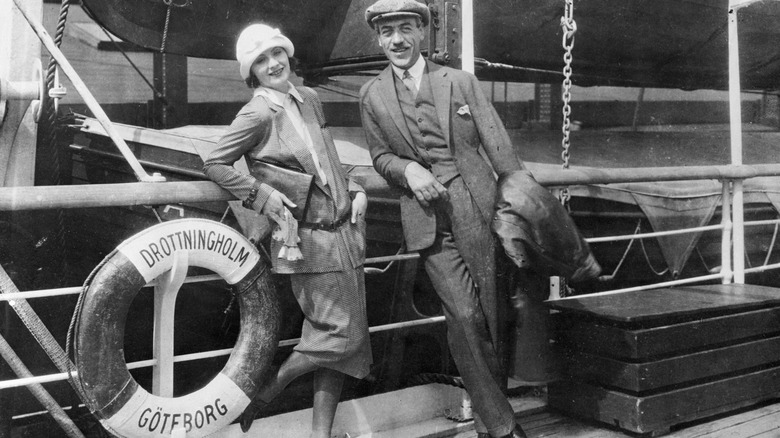 Greta Garbo and Mauritz Stiller standing on boat