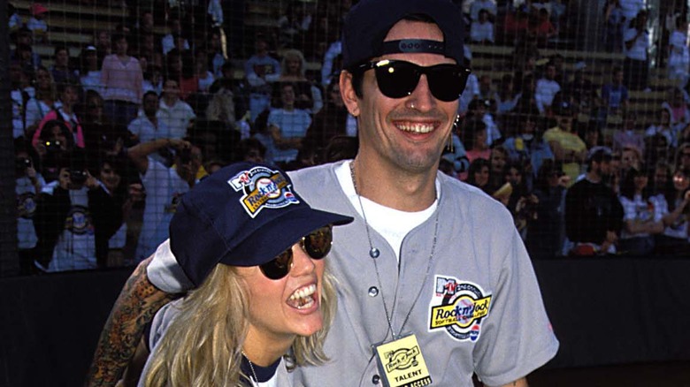 Heather Locklear and Tommy Lee in softball jerseys