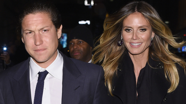 Vito Schnabel looking grim and Heidi Klum smiling