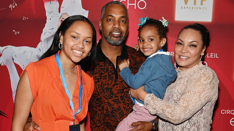 Mike Jackson and Egypt Sharrod post with their daighters Kendall and Harper